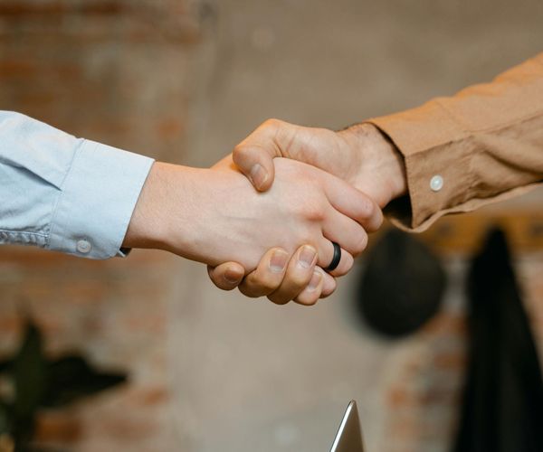 Close up of hands clasped together in a mindful gesture.